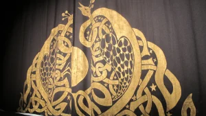 Gold applique on drapes manufactured by J&C Joel.