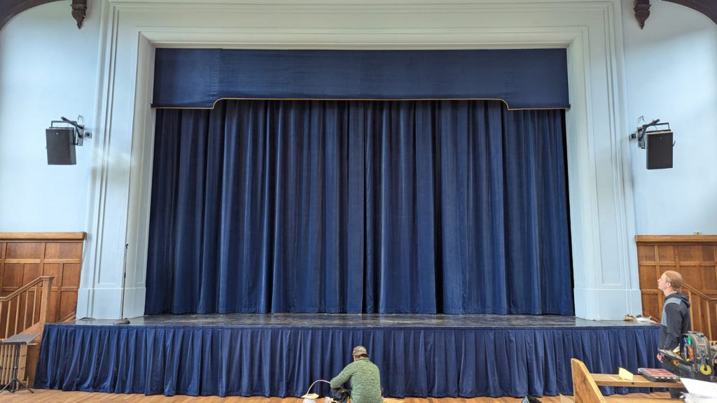 An image showing the stage of Bancroft's School Great Hall